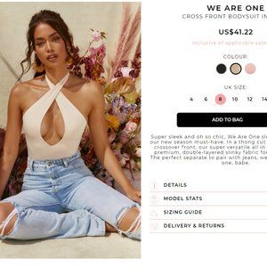 WE ARE ONE CROSS FRONT BODYSUIT IN IVORY